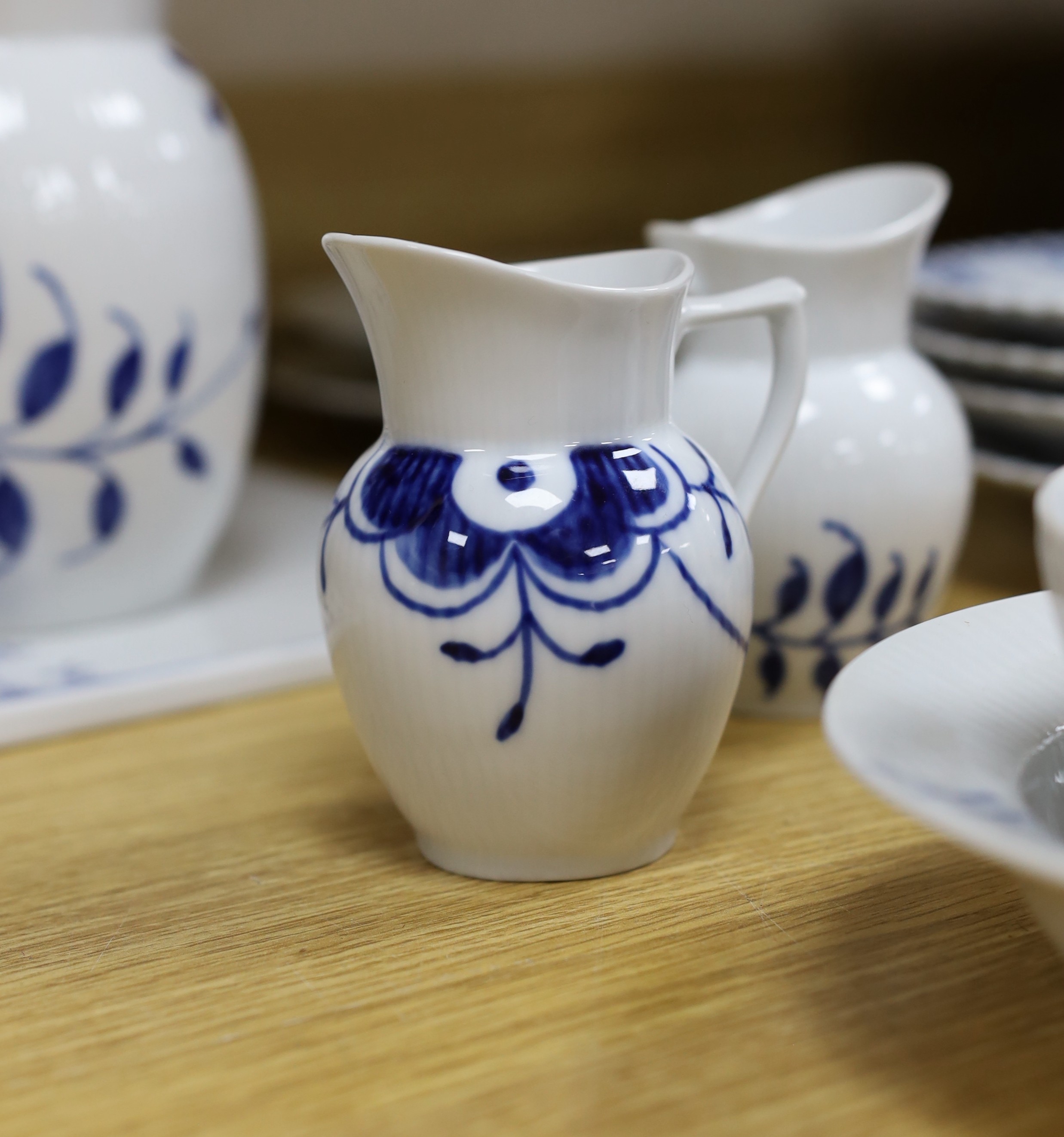 A collection of varying patterns of Royal Copenhagen blue and white tableware
